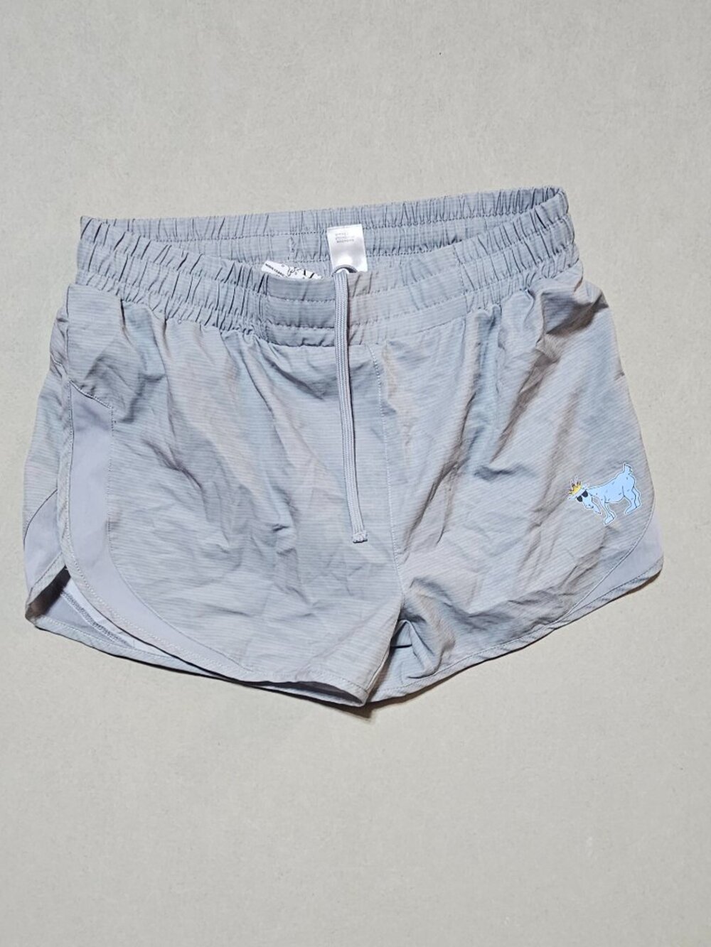 GOAT USA women's athletic shorts, size small, gray.